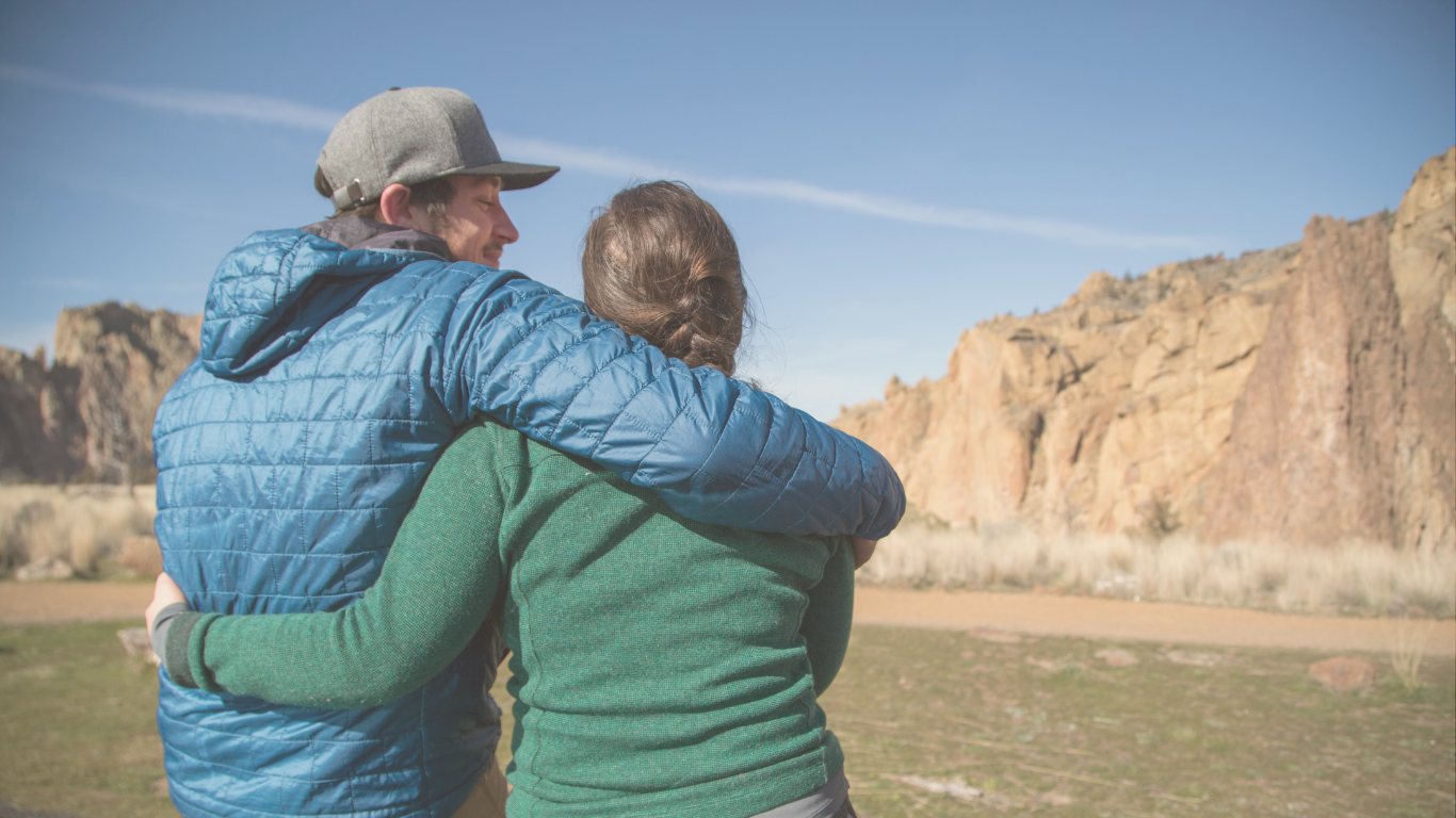 A couple enjoying the scenic views at Smith Rock State Park during their digital nomad RV trip.